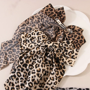 Handmade leopard print bow hair clip with long ribbons and metal spring fastener