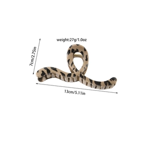 Detail showing 13cm leopard print hair claw clip with size measurements and gold spring