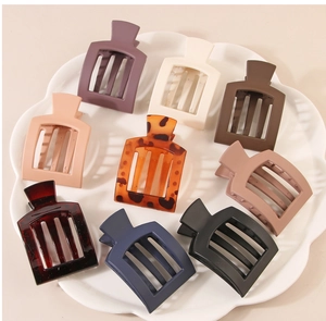Detailed set of nine square matte and glossy hair claws in diverse trendy colors and patterns