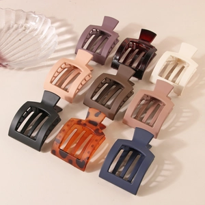 9-piece set of large square matte hair claws in various colors for minimalist styling