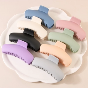 Set of eight matte large hair claw clips in assorted pastel macaron colors for women