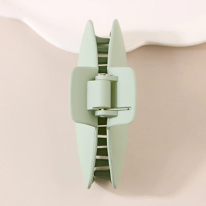 Matte mint green large shark hair claw clip for women with minimalist oval plastic design