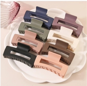 Eight-piece set of matte geometric square hair claws in assorted neutral colors