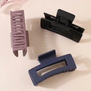 Minimalist square geometric hair claw clips in matte purple, black, and navy blue
