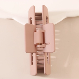 Minimalist square PC hair claw clip in matte morandi pink with hollow rectangular design