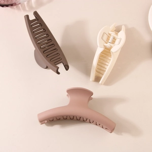 Matte finish oval hair claw clips in coffee, cream and pink for thick hair styling