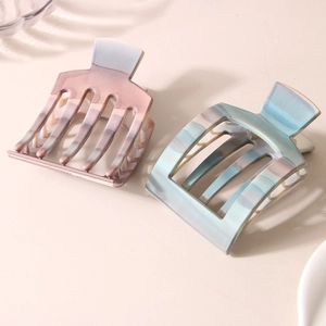 Elegant PC hair clips in gradient pink and blue marble textures for voluminous hair styling