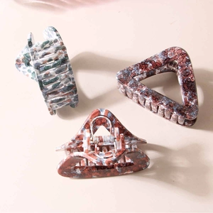 Three geometric hollow hair claws with marble texture and strong metal springs