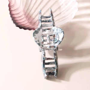 Oversized blue marble butterfly hair claw clip for thick hair styling in a chic layout