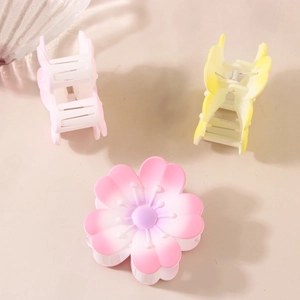 Three-piece floral hair claw clips in matte pastel colors and sakura blossom design