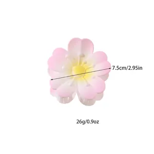 Pink cherry blossom hair claw clip with gradient petals and yellow center in 7.5cm size