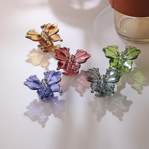 Hollow butterfly hair claws in five translucent colors with vibrant colored shadows