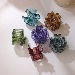 Set of six colorful 4cm flower hair claws in acrylic finish with elegant petal design