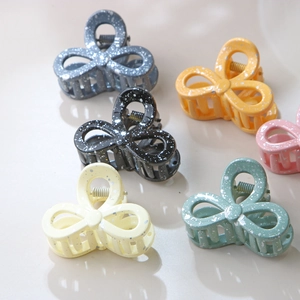 Bow-knot hair clips set in multiple colors with white paint splatter texture