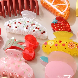 Chic acetate fruit hair claw set featuring cherry, peach and orange designs with rhinestones