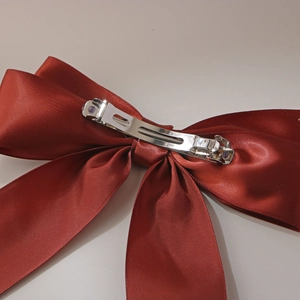 Elegant dark red satin bow hair clip with a silver metal spring clip for women