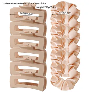 Detail view of 12-piece hair set with matte brown clips and satin scrunchies for women