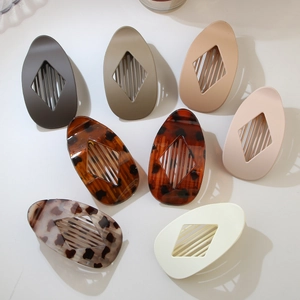 Set of eight flat oval diamond hair clips in various solid colors and tortoiseshell patterns