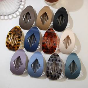 Detailed set of 11 leopard and solid color hair clips with matte finish and hollow design