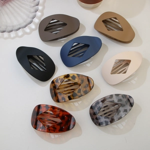 Flat view of large matte and leopard print claw clips for hair styling accessories