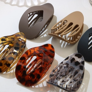 Flat lay of leopard print hair claws in various tortoiseshell patterns and matte finishes