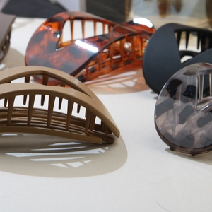 Set of stylish leopard print and matte flat hair clips in various patterns and colors