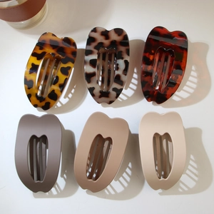 Flat hair clips set showing six leopard and matte colors on a white surface with shadows