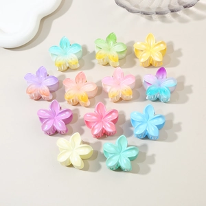 Detailed collection of 11 colorful macaron gradient flower hair claws on beige backdrop