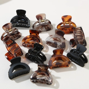 12-piece set of mini french semi-circle hair claws in marble and tortoiseshell patterns