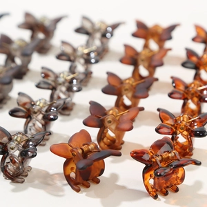 12-piece mini butterfly hair claw clips in tortoise shell patterns and dark neutral tones