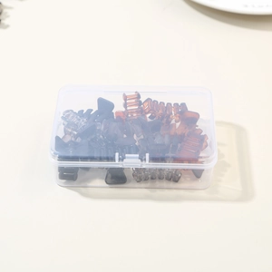 Compact storage box filled with mini hair claw clips in black and amber brown colors