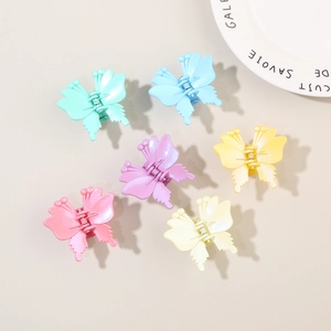 Set of 6 colorful butterfly hair claws in matte macaron shades for elegant hair styling