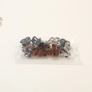 Detailed set of 12 mini macaron hair claws in assorted marble and tortoiseshell patterns