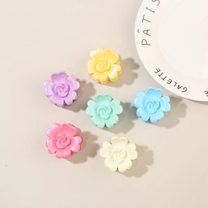 Detailed set of six colorful rose hair claw clips in pearl finish for summer hairstyles