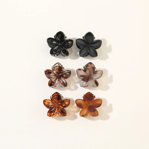 Set of six mini floral hair claws in marble and amber resin with matte and glossy finishes