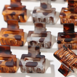 12-piece set of square tortoiseshell hair claw clips in brown and leopard patterns