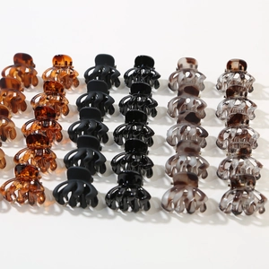 Set of 12 geometric octopus hair clips in tortoiseshell, matte black, and marble