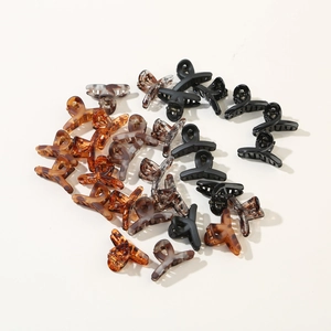 Set of 12 mini cross-designed claw clips in multi-color finishes for daily hair styling