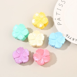 Set of six colorful hibiscus flower hair clips in vibrant pastel shades for women