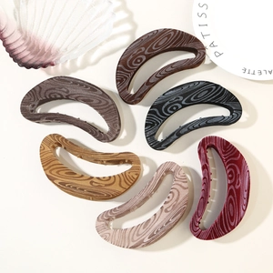 French vintage crescent hair clips in six velvet colors with natural wood grain texture