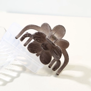 Dark brown flocked four-leaf clover flower hair claw clip with elegant velvet texture