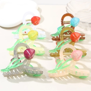 Detail showing tulip claw clips in various colors including pink, yellow, and green