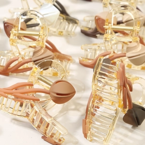 Elegant amber tulip hair claw clips with matte 3D flowers and gold metal spring