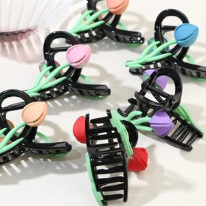 Elegant tulip flower hair claw clips in various colors with a sleek black spring design