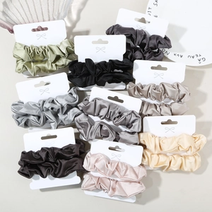 Set of two satin silk scrunchies in multiple colors with elegant gift card packaging
