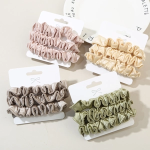 Set of 4 French style pleated silk-like scrunchies in Morandi colors on display card