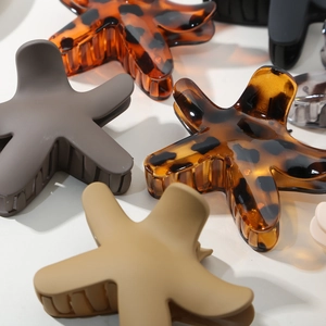 Chic starfish hair claw clips in matte and amber finishes for women's hairstyling