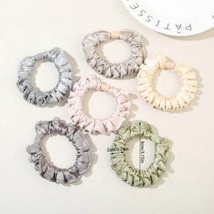 6-piece set of silk satin scrunchies in neutral tones measuring 8cm in diameter