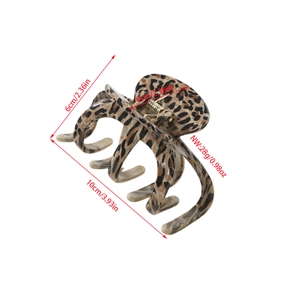 Detail view of leopard print hair claw clip showing 10cm x 6cm dimensions and gold spring