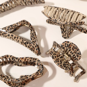 Set of four leopard print large hair claws in various geometric shapes for women